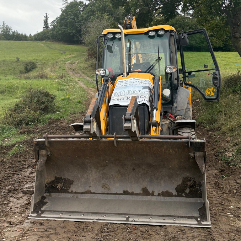 Žlutní bagr se lžící